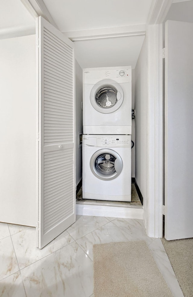 laundry room with stacked washer and dryer