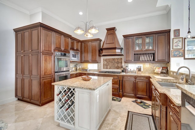 kitchen with custom exhaust hood, an inviting chandelier, sink, appliances with stainless steel finishes, and decorative light fixtures