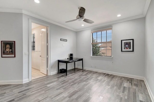 unfurnished room featuring ceiling fan, ornamental molding, and light hardwood / wood-style flooring