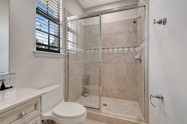 bathroom featuring an enclosed shower and toilet