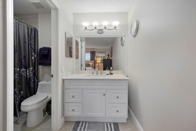 full bathroom featuring shower / bathtub combination with curtain, vanity, and toilet