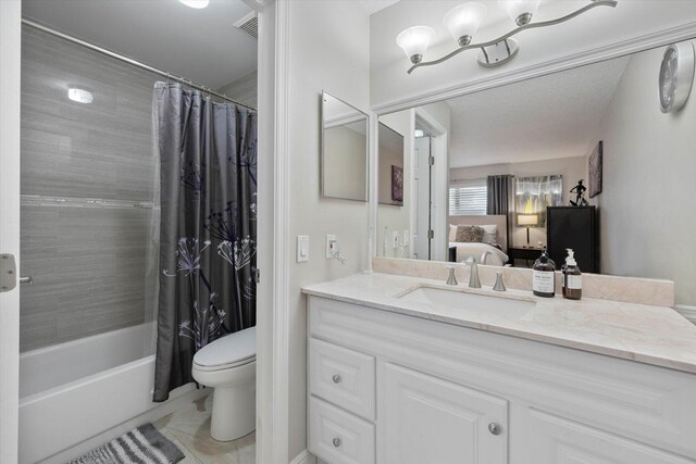 bathroom with shower / bath combo and toilet