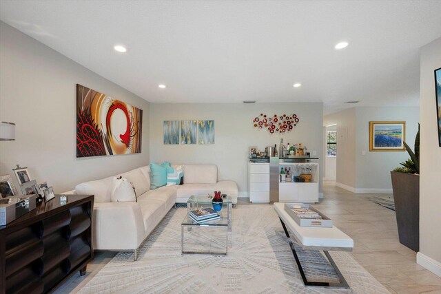 living room with a textured ceiling