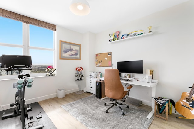 office space with light wood-type flooring