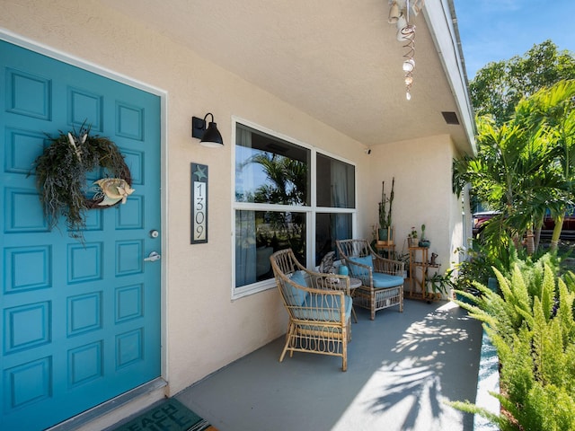 entrance to property featuring covered porch