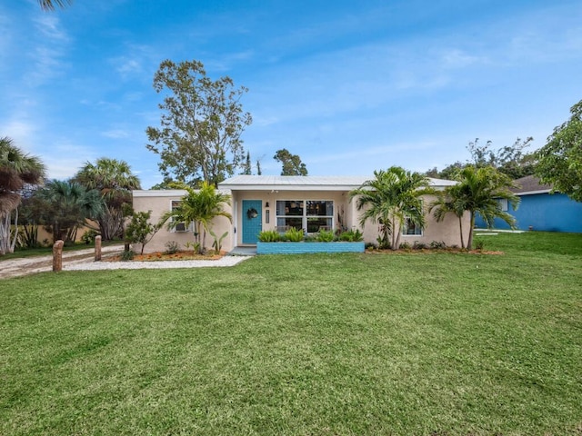 ranch-style house featuring a front lawn