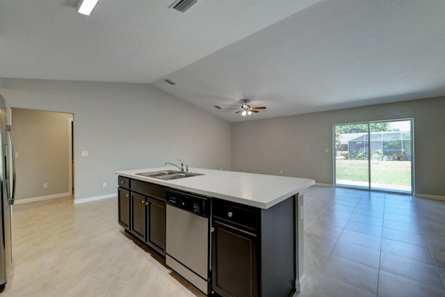 kitchen with appliances with stainless steel finishes, ceiling fan, sink, lofted ceiling, and an island with sink