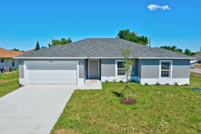 ranch-style home with a front yard, a garage, and central AC unit