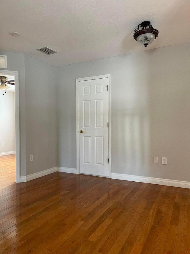 unfurnished room featuring wood-type flooring