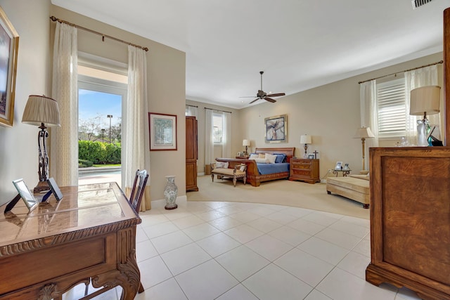 bedroom featuring light tile patterned floors and ceiling fan