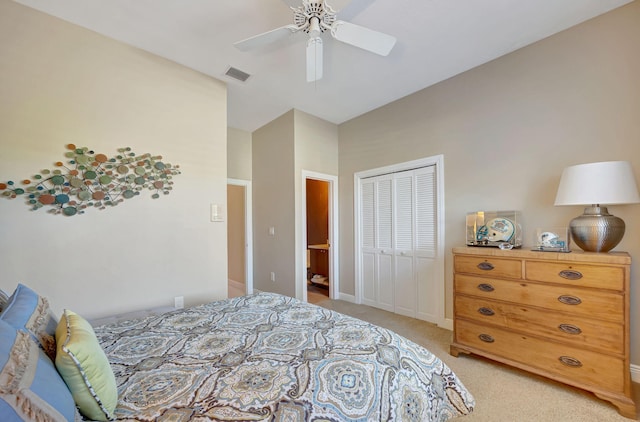 carpeted bedroom featuring ceiling fan and a closet