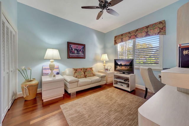 home office with wood-type flooring and ceiling fan