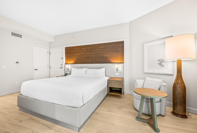 bedroom with light wood-type flooring