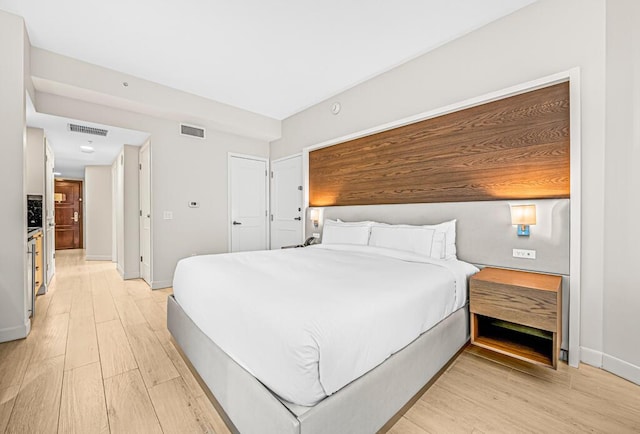 bedroom featuring light hardwood / wood-style flooring