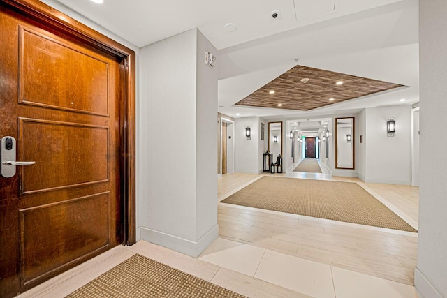 hallway featuring light tile patterned floors