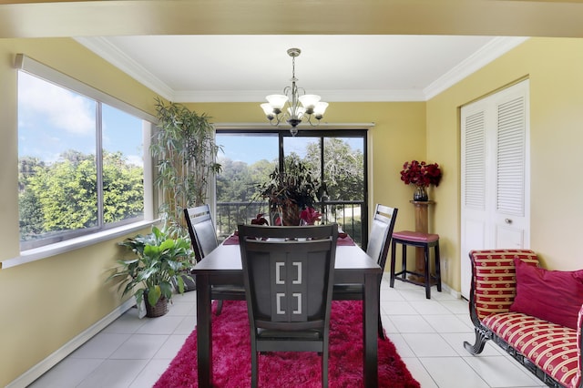 dining room featuring an inviting chandelier, crown molding, light tile patterned floors, and a wealth of natural light