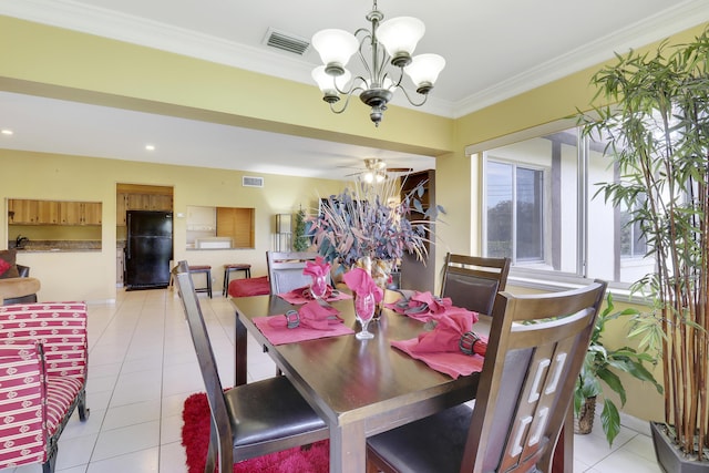 dining space with crown molding, ceiling fan with notable chandelier, and light tile patterned floors