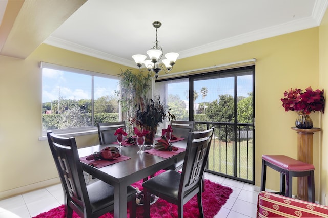 dining area featuring crown molding, an inviting chandelier, and a wealth of natural light