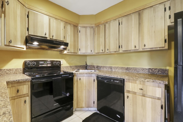 kitchen with light tile patterned floors, sink, light brown cabinets, and black appliances