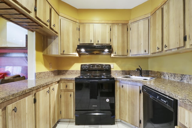 kitchen featuring light brown cabinetry, sink, and black appliances