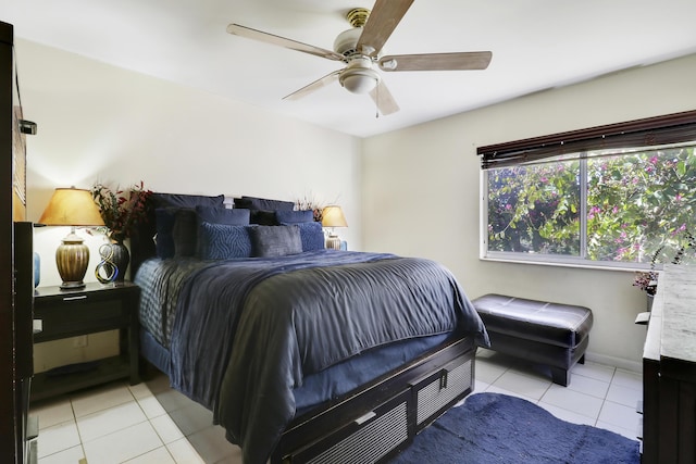 bedroom with ceiling fan and light tile patterned flooring