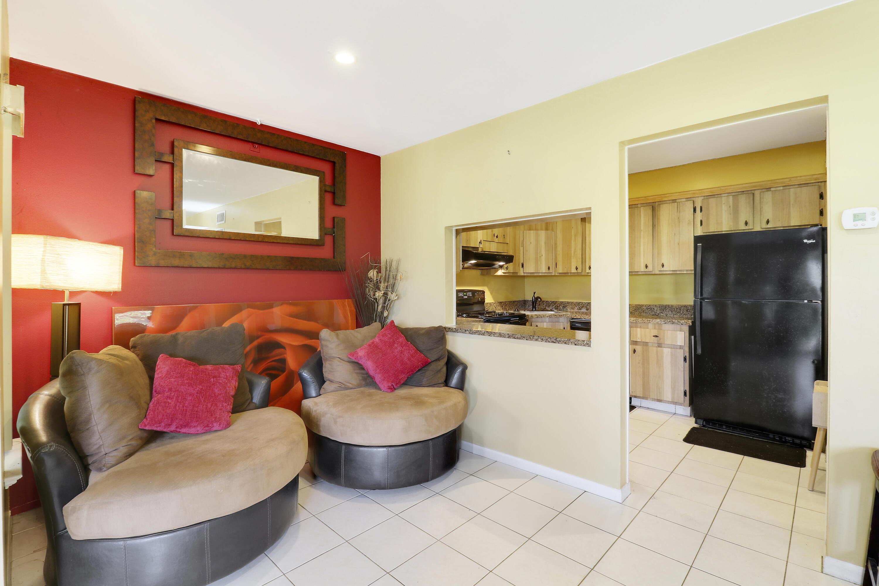 sitting room featuring light tile patterned flooring and sink