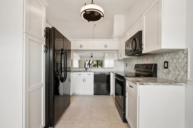 kitchen with white cabinetry, light tile patterned floors, black appliances, and ceiling fan