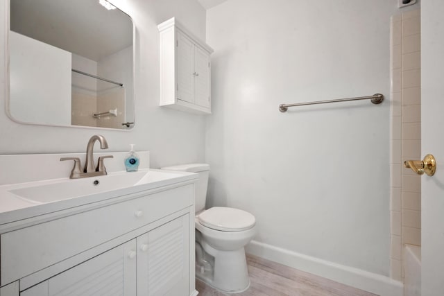 full bathroom featuring vanity, toilet, wood-type flooring, and bathtub / shower combination