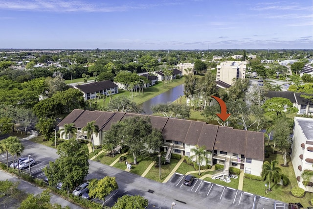 birds eye view of property featuring a water view