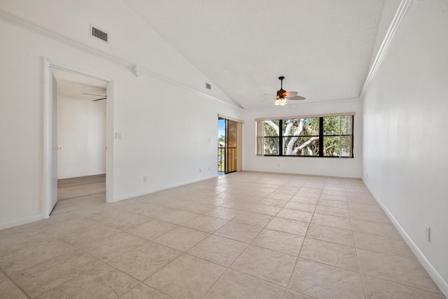 tiled spare room featuring ceiling fan and lofted ceiling