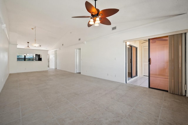 unfurnished living room featuring ceiling fan, light tile patterned floors, and vaulted ceiling