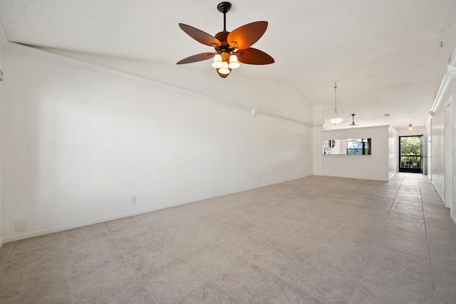 tiled empty room with vaulted ceiling and ceiling fan