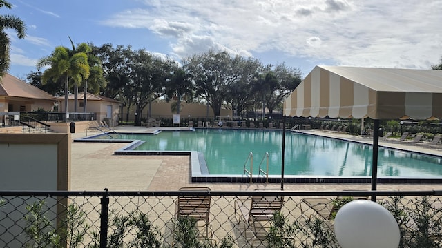 view of swimming pool with a patio