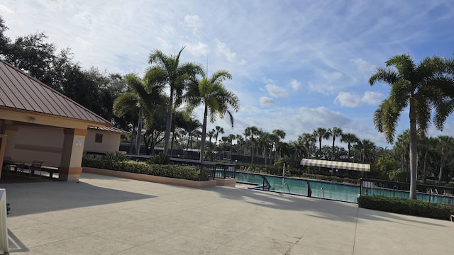 view of swimming pool featuring a patio