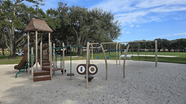 view of playground with a lawn