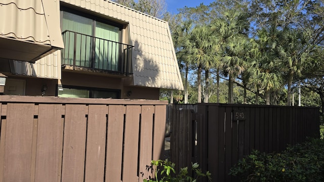 view of home's exterior with a balcony