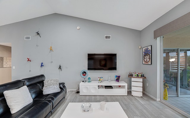 living room with lofted ceiling