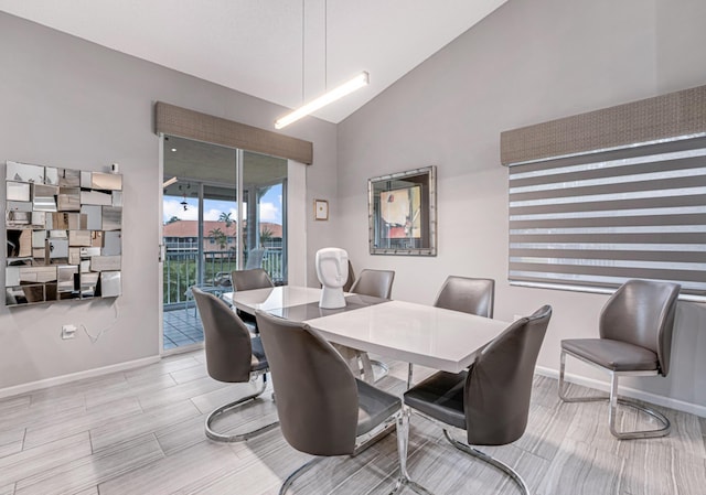 dining area with lofted ceiling