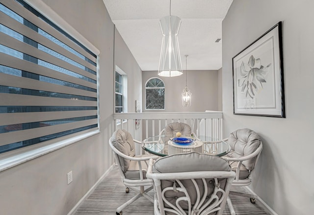 dining area featuring hardwood / wood-style flooring