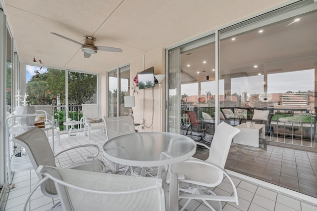 sunroom / solarium with ceiling fan