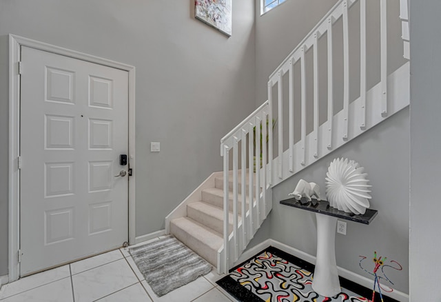 entryway with light tile patterned floors