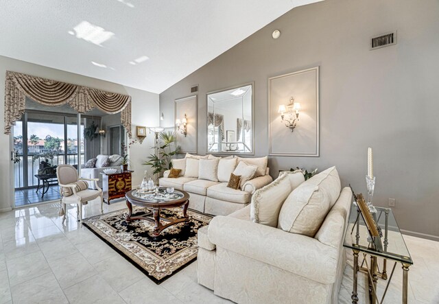 9817 Seacrest Cir Unit 201, Boynton Beach, FL 33437 - living area featuring baseboards, high vaulted ceiling, and visible vents