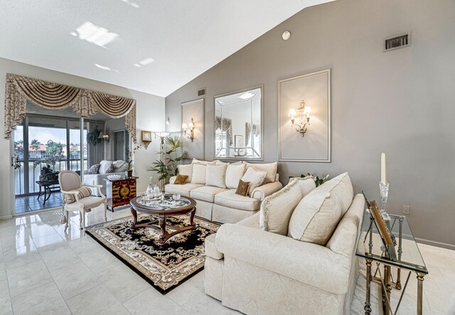 dining room featuring lofted ceiling and a notable chandelier