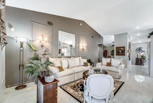 dining room featuring a notable chandelier, lofted ceiling, a textured ceiling, and light tile patterned floors