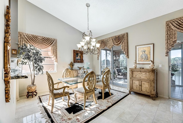 9817 Seacrest Cir Unit 201, Boynton Beach, FL 33437 - dining area featuring vaulted ceiling, rail lighting, a textured ceiling, baseboards, and a chandelier