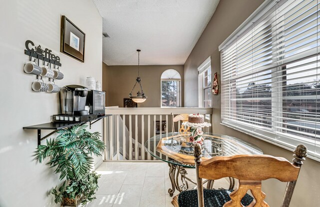 kitchen with appliances with stainless steel finishes, vaulted ceiling, decorative backsplash, and white cabinetry