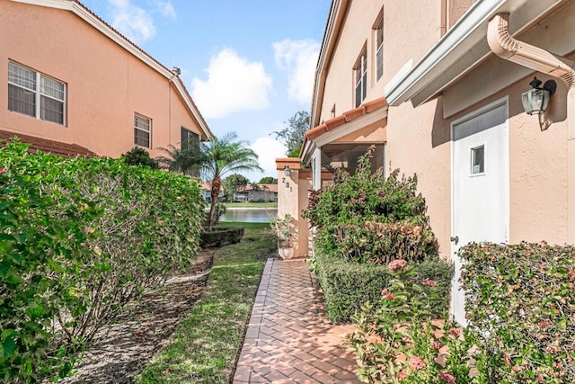 9817 Seacrest Cir Unit 201, Boynton Beach, FL 33437 - foyer entrance featuring light tile patterned floors, stairway, a high ceiling, and baseboards