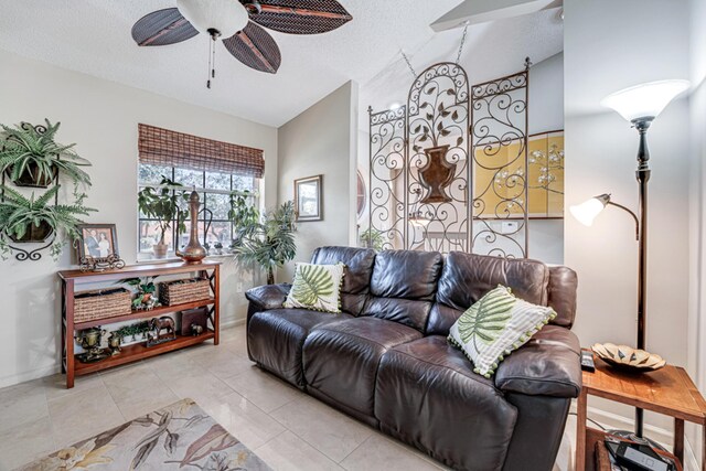 tiled dining room featuring a textured ceiling