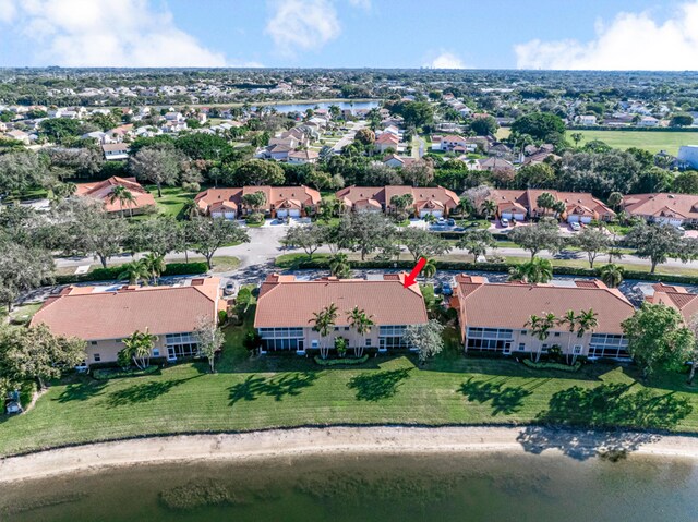 9817 Seacrest Cir Unit 201, Boynton Beach, FL 33437 - rear view of property featuring a lawn, a sunroom, stucco siding, and a tiled roof