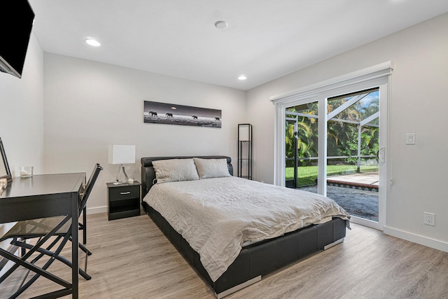 bedroom featuring access to outside and light wood-type flooring